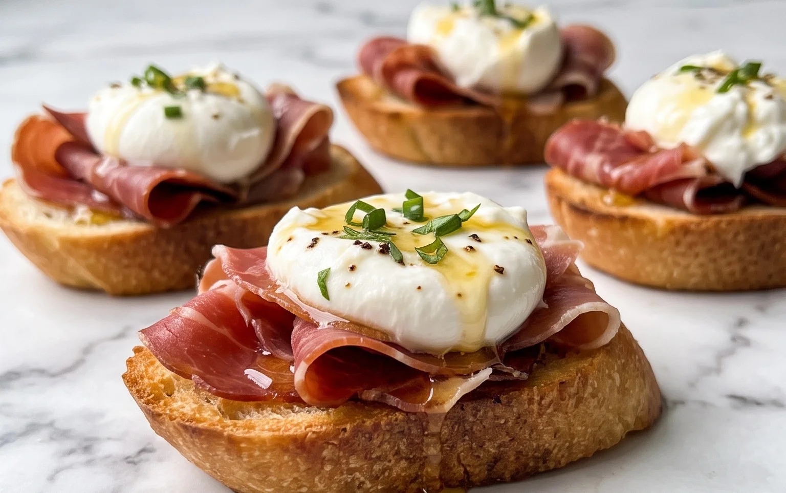 Beef Prosciutto Crostini with Burrata and Lemon Honey Drizzle